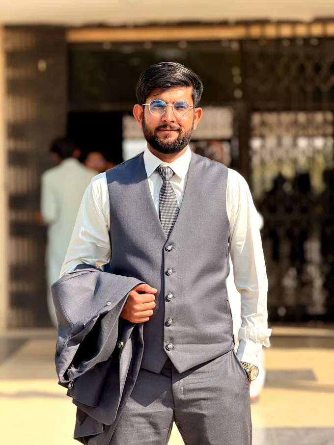Zulfiqar Alam in a grey waistcoat and tie
